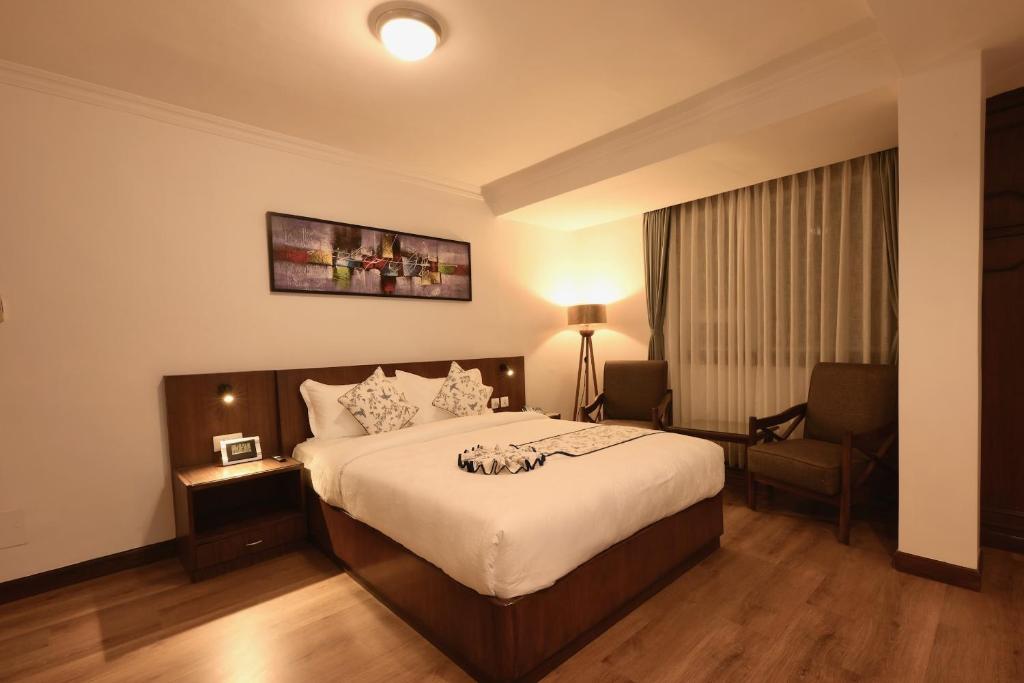 Postel nebo postele na pokoji v ubytování Gallery Park Hotel