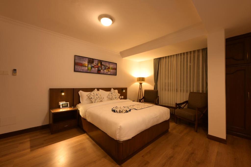 Postel nebo postele na pokoji v ubytování Gallery Park Hotel