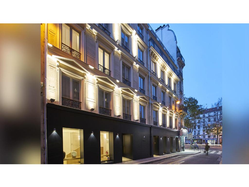 a building on the side of a street at 9Hotel Republique in Paris