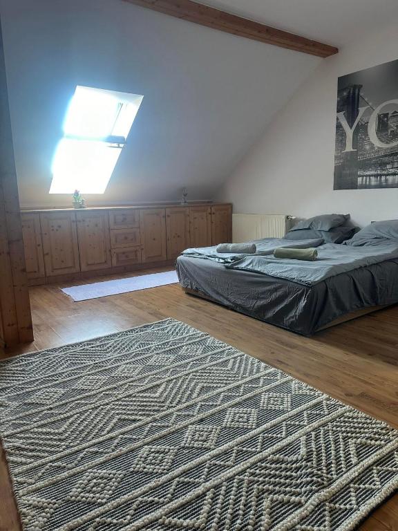 Postel nebo postele na pokoji v ubytování Hotello Apartmanház és Panzió