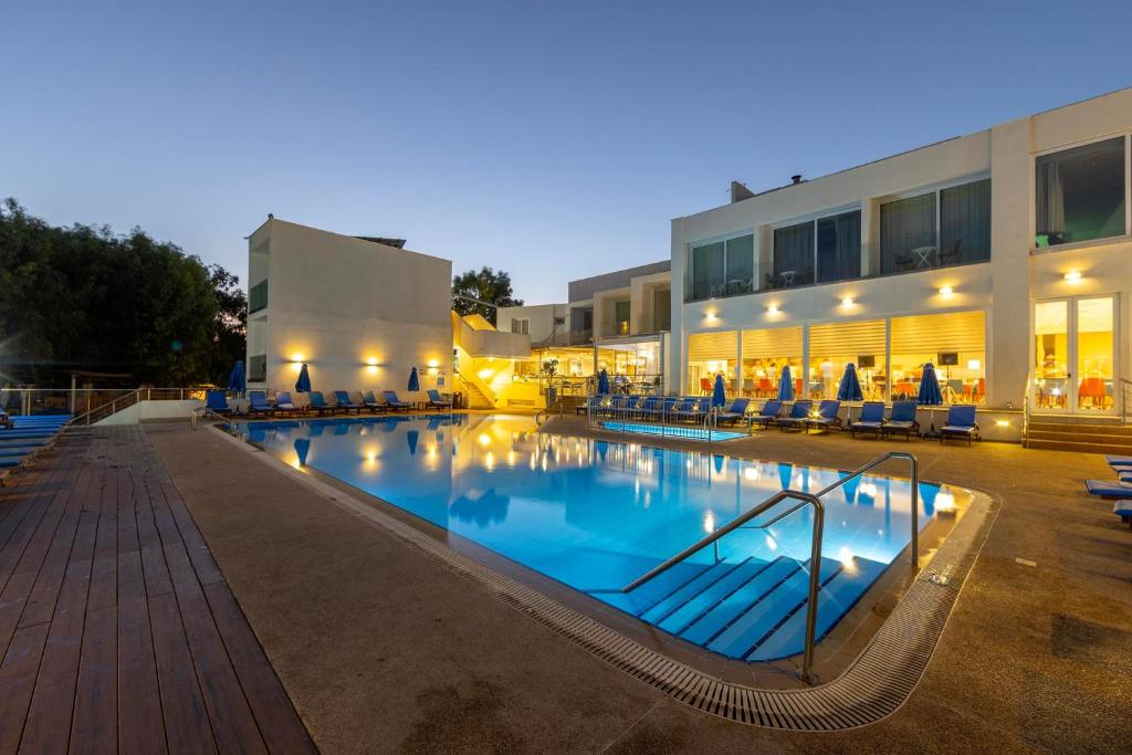 a large swimming pool in front of a building at Park Beach Hotel in Limassol
