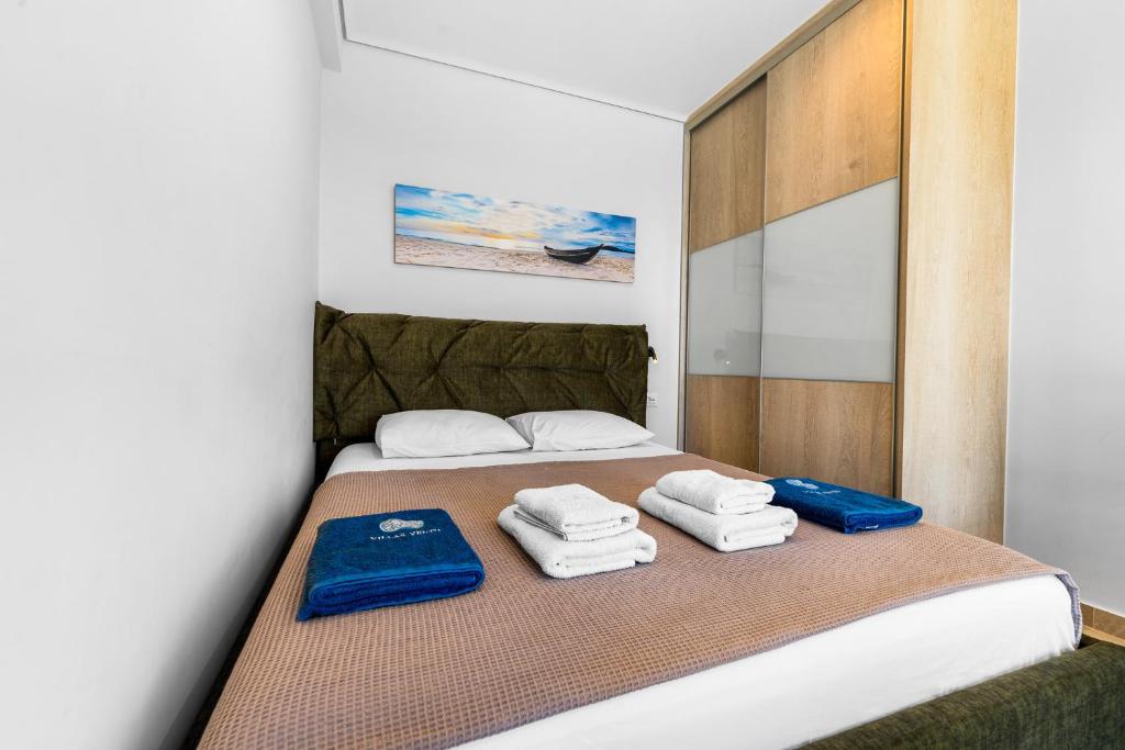 Postel nebo postele na pokoji v ubytování Vento Villas