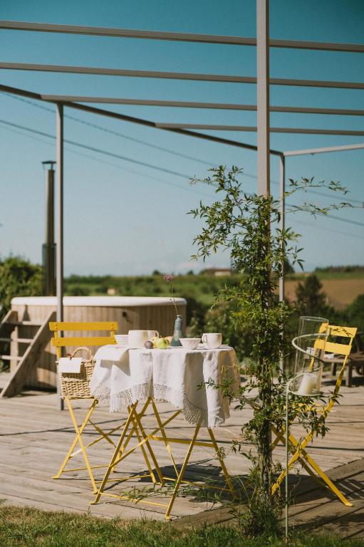 a table and chairs sitting on a patio at Casa Kiko Pecetto in Pecetto