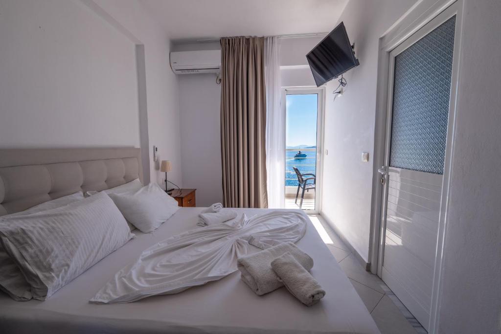 Postel nebo postele na pokoji v ubytování Erioni Hotel