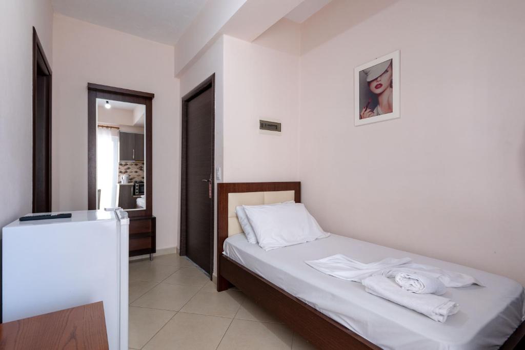 Postel nebo postele na pokoji v ubytování Erioni Hotel