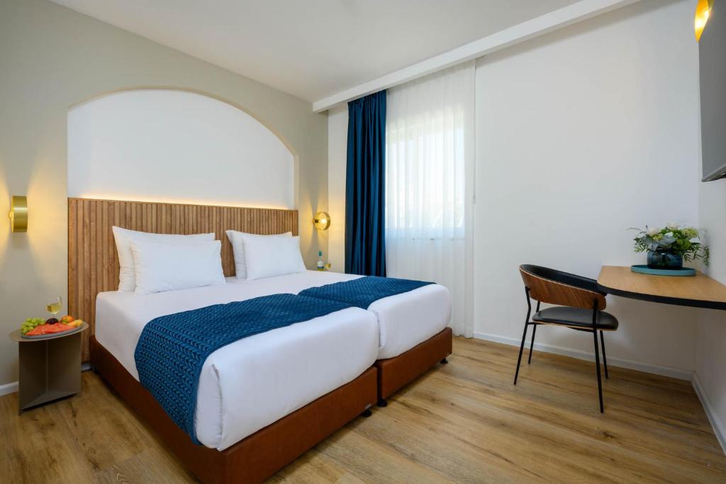 Postel nebo postele na pokoji v ubytování Prima Palace Hotel
