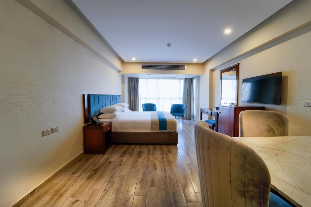 Postel nebo postele na pokoji v ubytování Stay Inn Pyramids Hotel