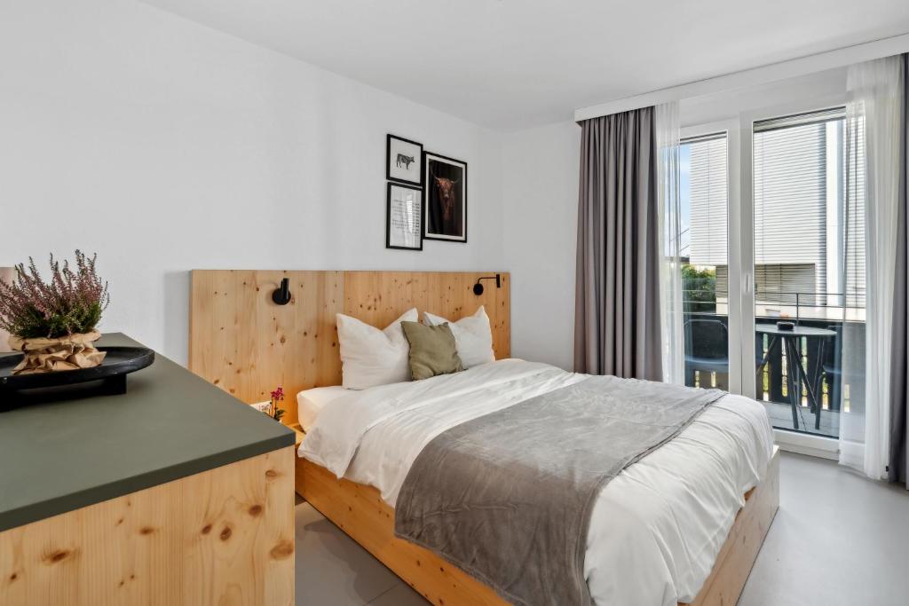Postel nebo postele na pokoji v ubytování Arbio I Rooms & Apartments Freiburg