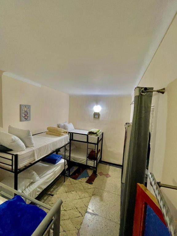 Postel nebo postele na pokoji v ubytování Blue Star Hostel