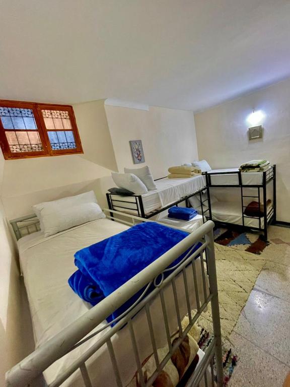 Postel nebo postele na pokoji v ubytování Blue Star Hostel
