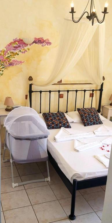 Postel nebo postele na pokoji v ubytování Aphrodite Boutique Hotel