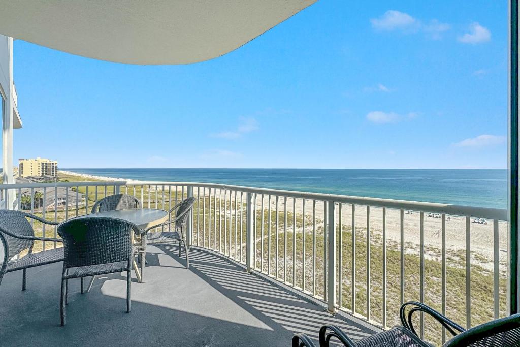 a balcony with chairs and a view of the beach at Spanish Key Unit 602 in Pensacola