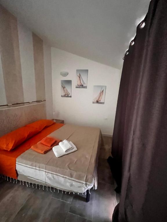 Postel nebo postele na pokoji v ubytování Villa Mbita Sardegna