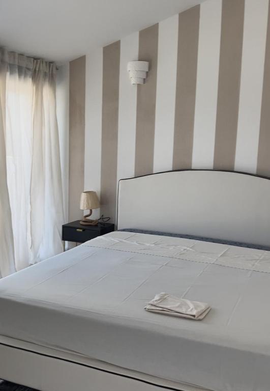 Postel nebo postele na pokoji v ubytování Villa Mbita Sardegna