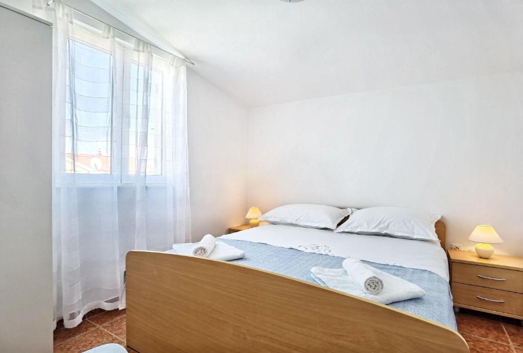 Posteľ alebo postele v izbe v ubytovaní Apartments Jera