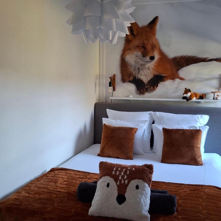 Postel nebo postele na pokoji v ubytování Le Renard'or