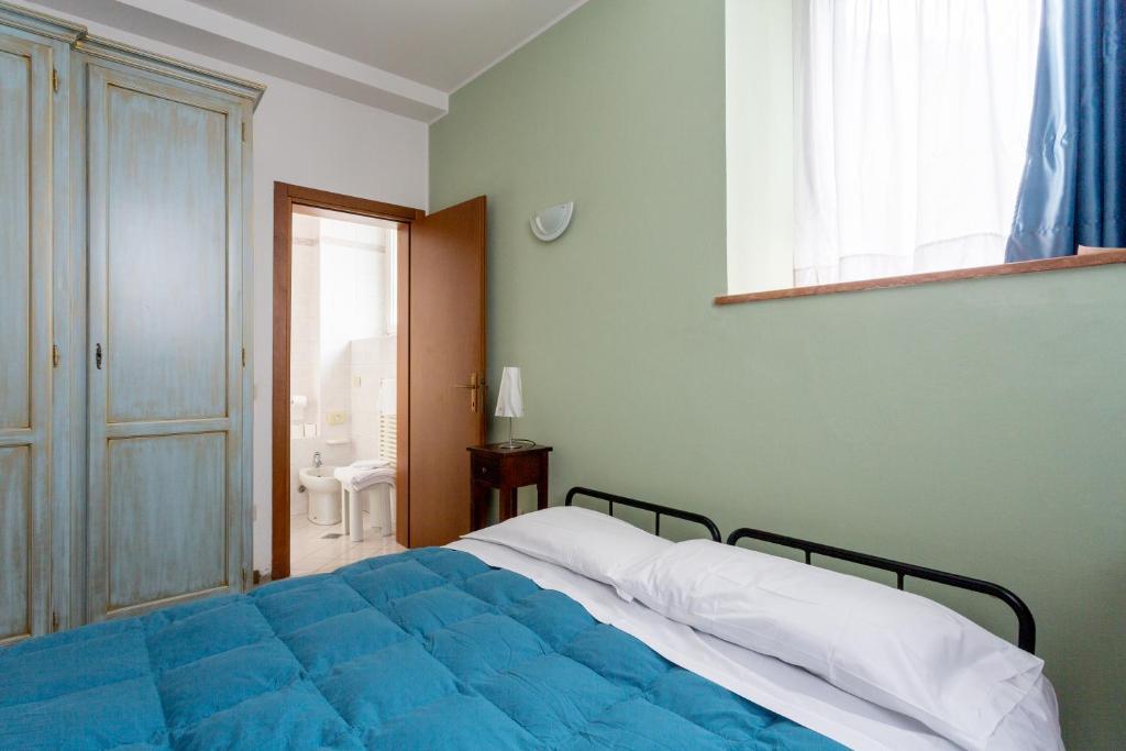 Postel nebo postele na pokoji v ubytování Alloggio Le Casette di Zecca Giorgia