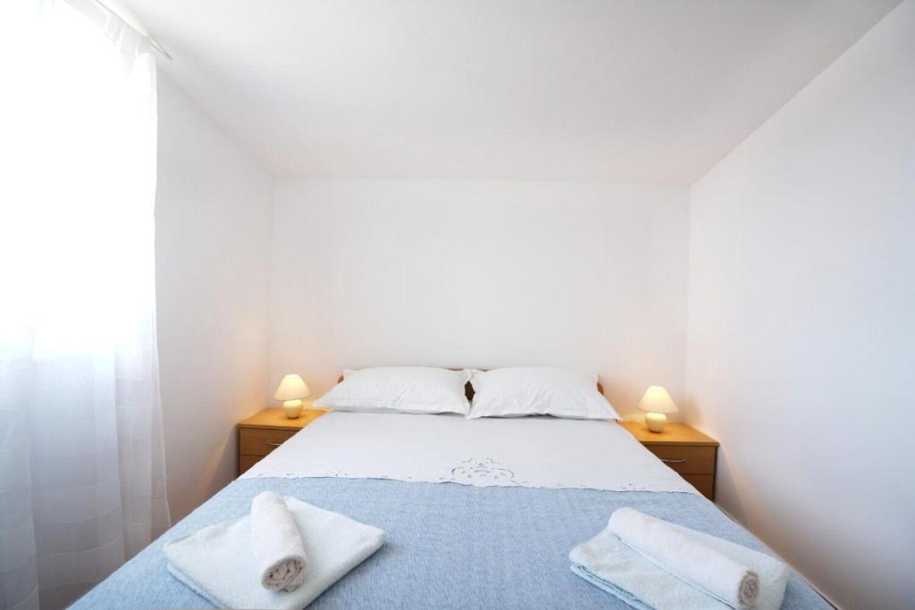 Posteľ alebo postele v izbe v ubytovaní Apartments Jera