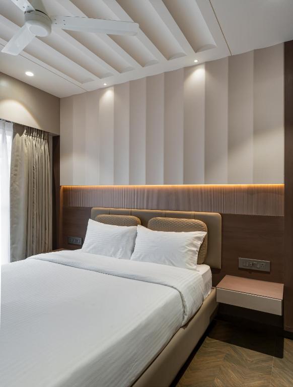 Postel nebo postele na pokoji v ubytování Orbit Serviced Apartments