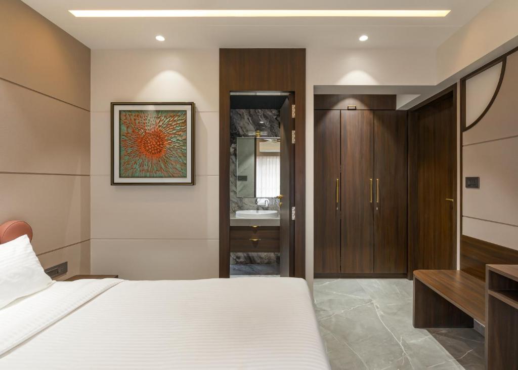 Postel nebo postele na pokoji v ubytování Orbit Serviced Apartments
