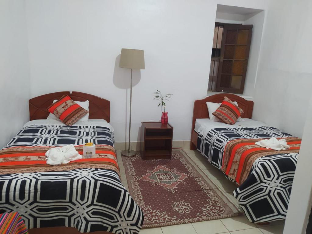 Postel nebo postele na pokoji v ubytování Hotel Kuelap Chachapoyas