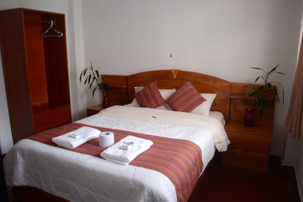 Postel nebo postele na pokoji v ubytování Hotel Kuelap Chachapoyas