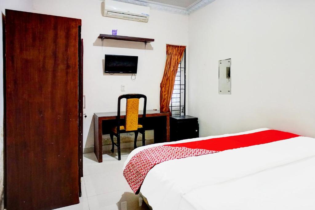 Postel nebo postele na pokoji v ubytování Hotel O Medan City Near Sun Plaza Formerly 99 Residence