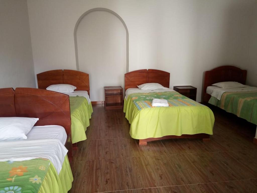 Postel nebo postele na pokoji v ubytování Hotel Kuelap Chachapoyas