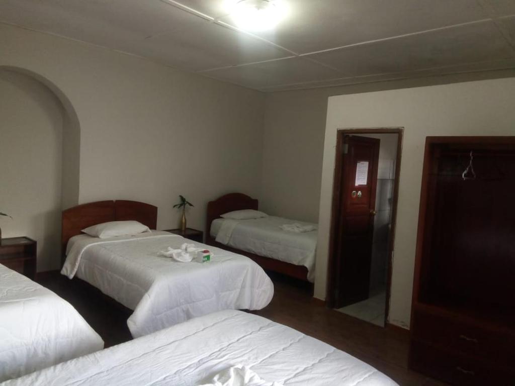 Postel nebo postele na pokoji v ubytování Hotel Kuelap Chachapoyas