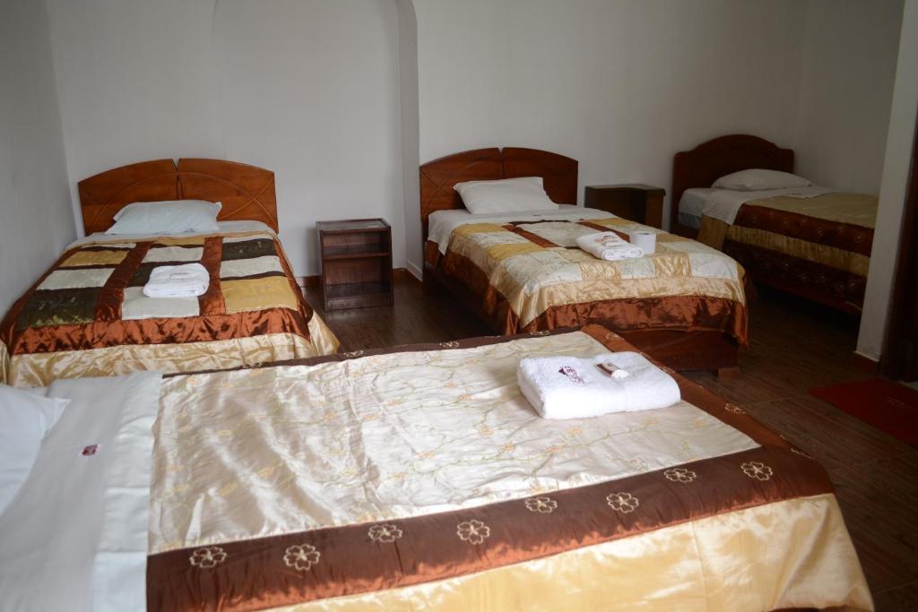 Postel nebo postele na pokoji v ubytování Hotel Kuelap Chachapoyas