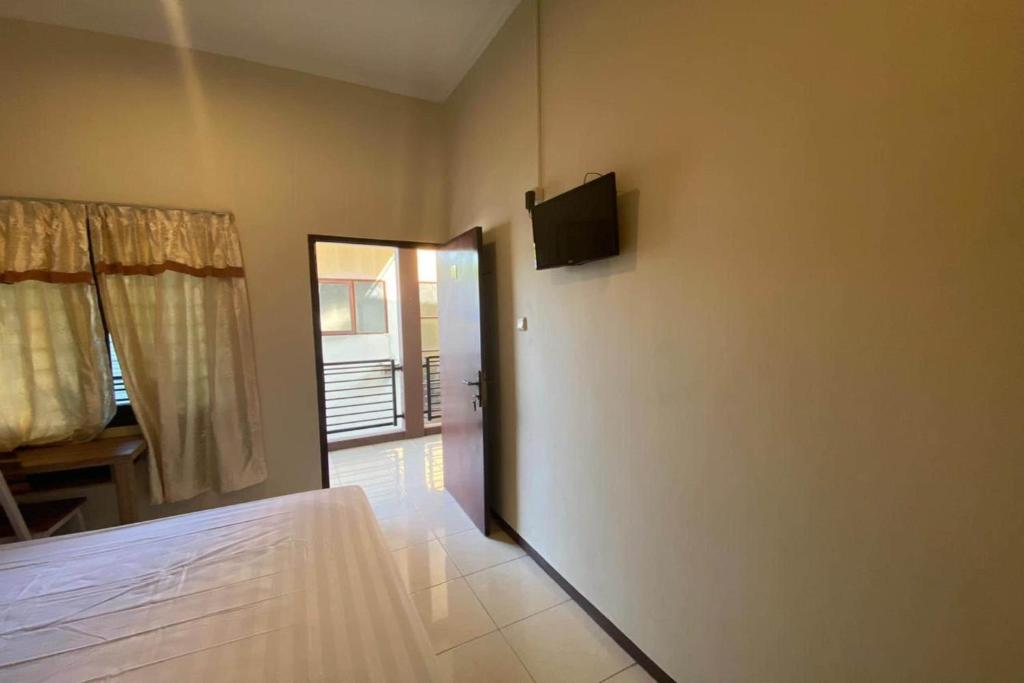 Postel nebo postele na pokoji v ubytování Sweet Home Residence Simpang Lima