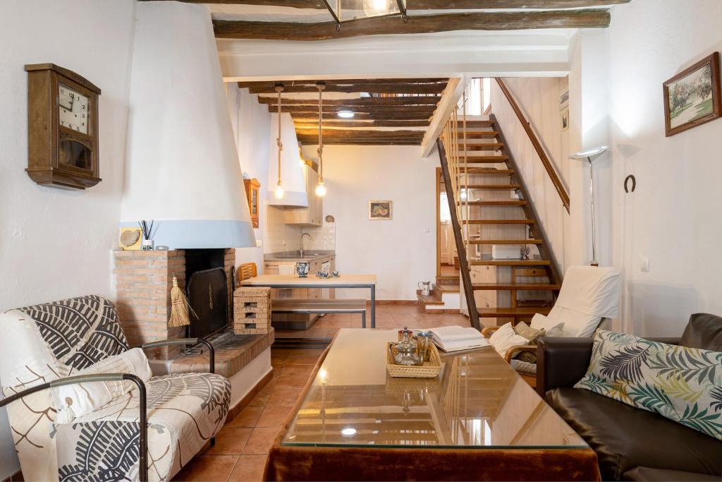 a living room with a couch and a table at Casa calle del Carmen in Grazalema