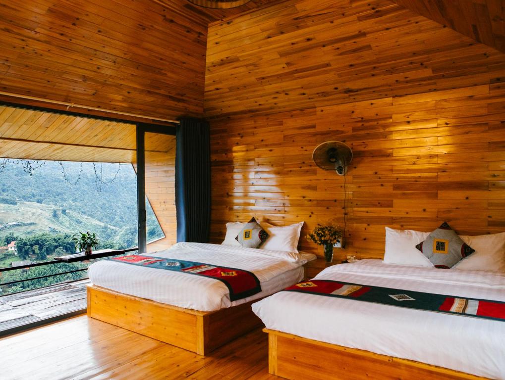 Postel nebo postele na pokoji v ubytování H'Mong Cát Cát Homestay