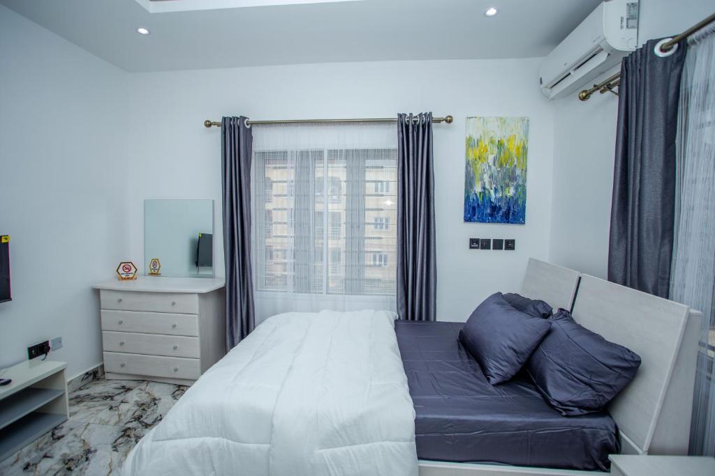 Postel nebo postele na pokoji v ubytování Aija Residences