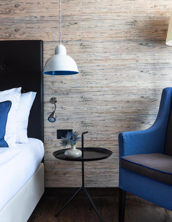 Postel nebo postele na pokoji v ubytování AMERON Luzern Hotel Flora