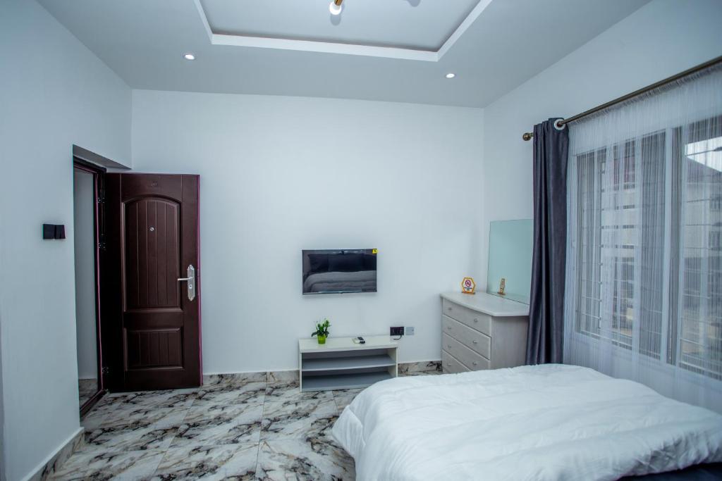 Postel nebo postele na pokoji v ubytování Aija Residences