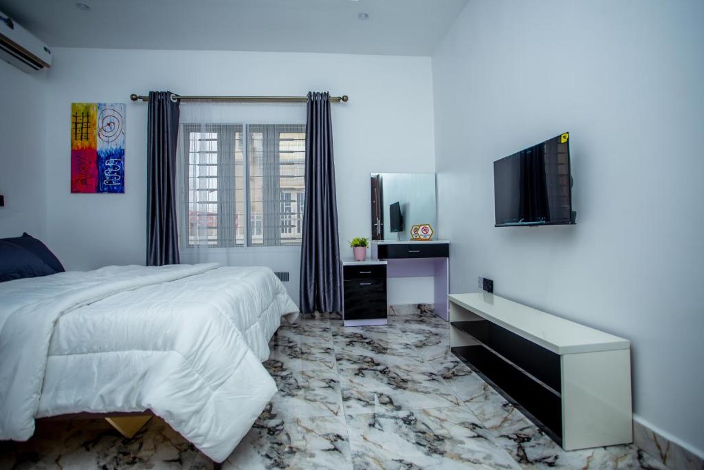 TV a/nebo společenská místnost v ubytování Aija Residences