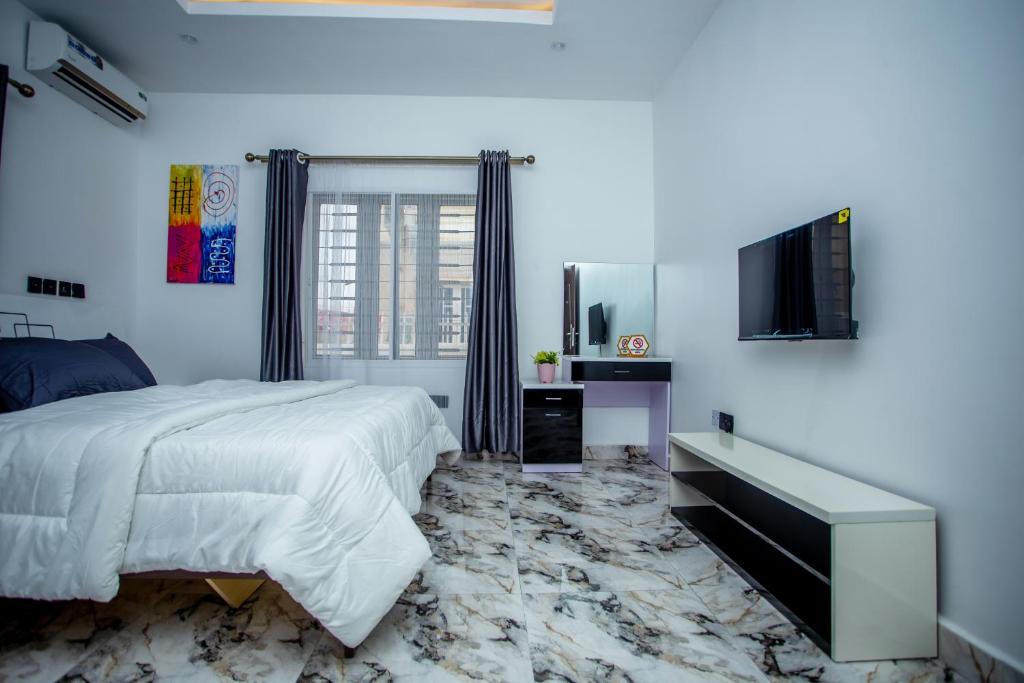 Postel nebo postele na pokoji v ubytování Aija Residences