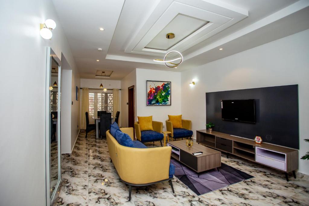 TV a/nebo společenská místnost v ubytování Aija Residences
