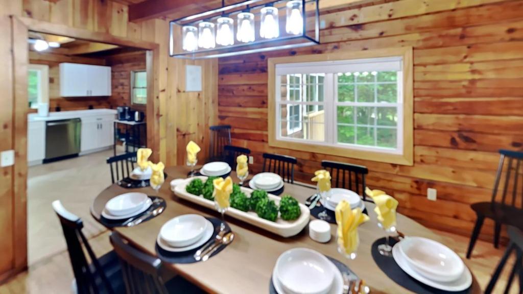 a dining room with a table in a cabin at Bucksport Bliss in Bucksport