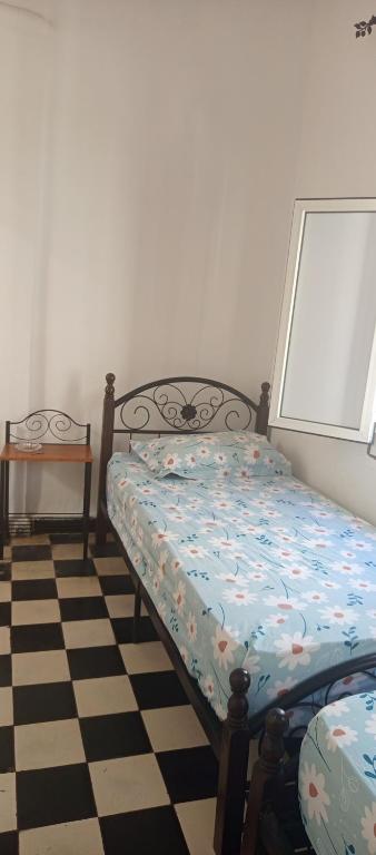Postel nebo postele na pokoji v ubytování L'Oa
