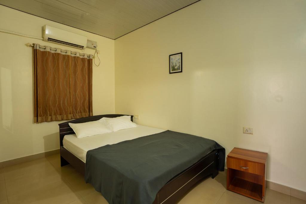 Postel nebo postele na pokoji v ubytování Gomes Pousada Guesthouse