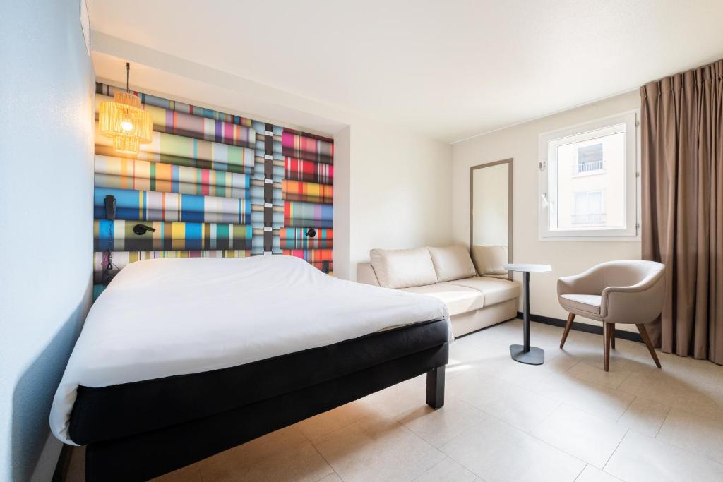 Postel nebo postele na pokoji v ubytování ibis Styles Perpignan Centre Gare