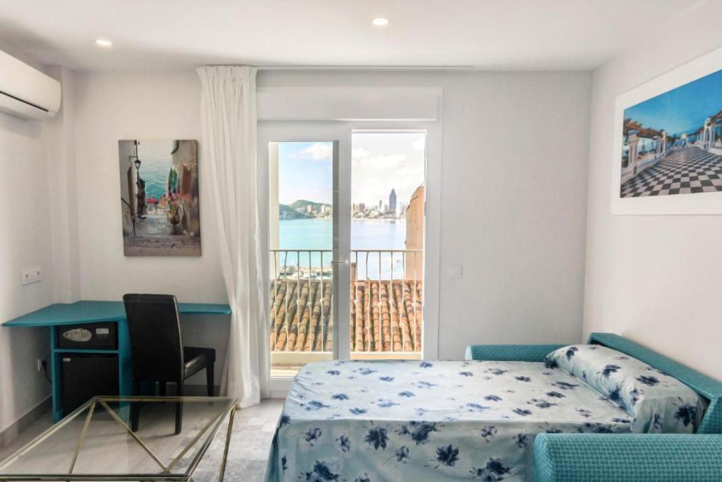 Postel nebo postele na pokoji v ubytování Hotel Clopy Rocamar