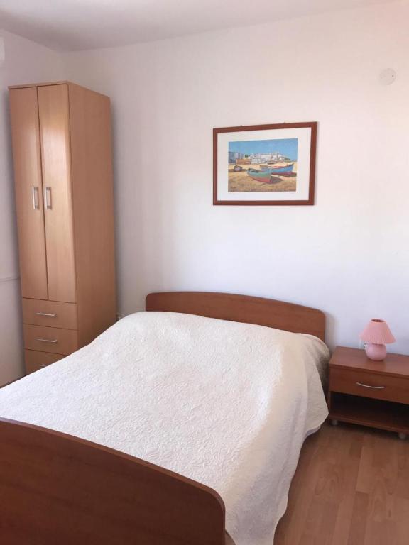 Posteľ alebo postele v izbe v ubytovaní Apartments Deni