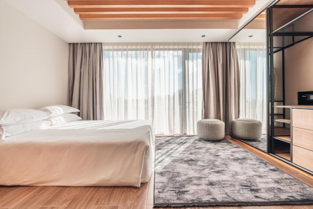 Postel nebo postele na pokoji v ubytování Probar Suites Punta Cana