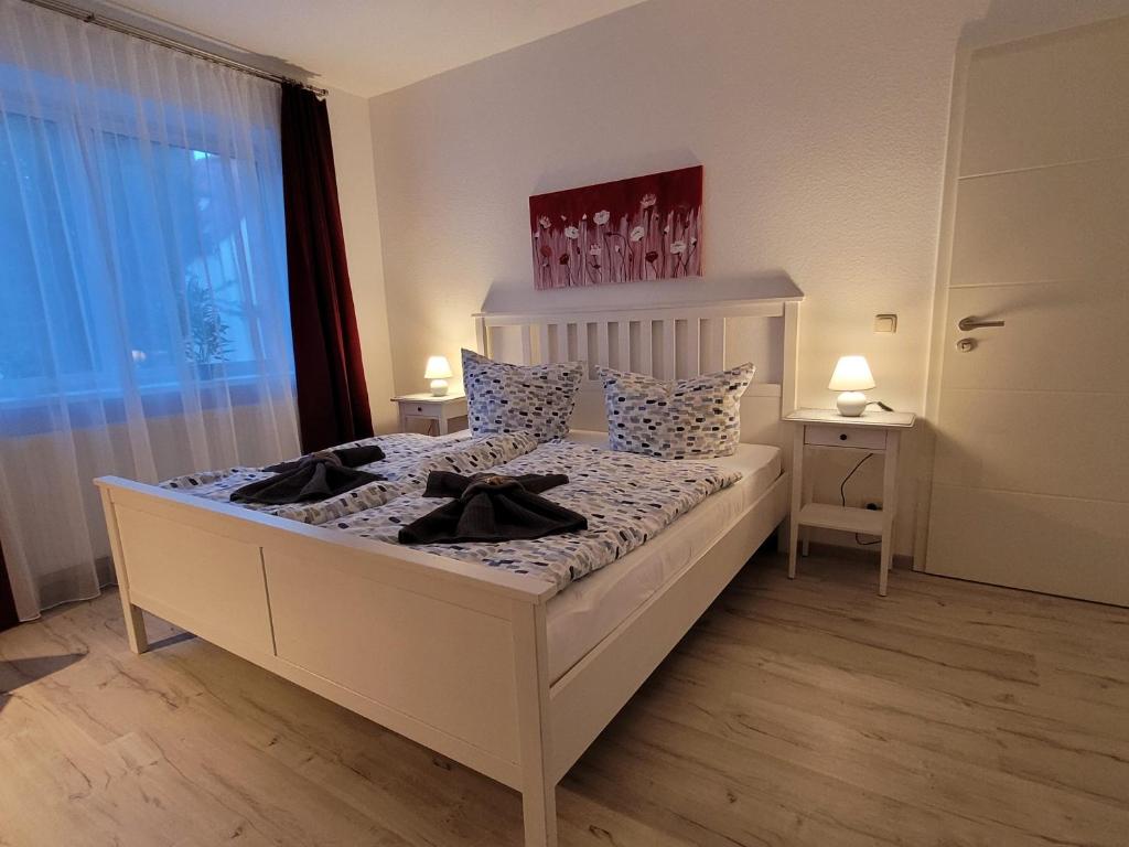 Postel nebo postele na pokoji v ubytování Ballenstedt Gartenblick