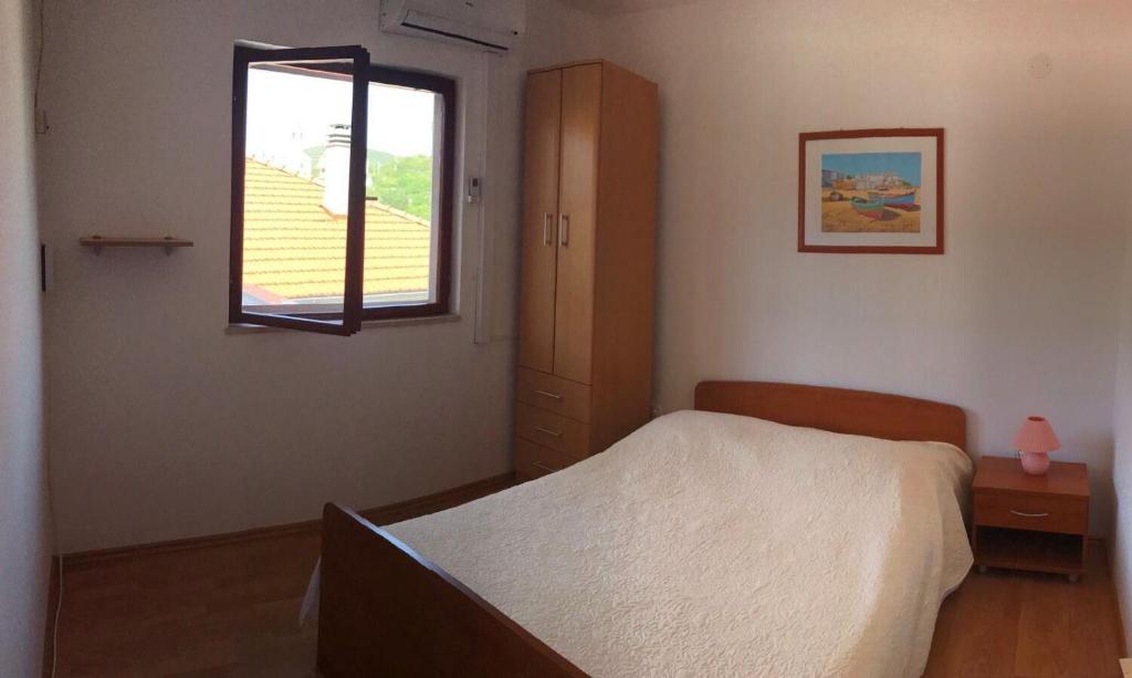 Posteľ alebo postele v izbe v ubytovaní Apartments Deni