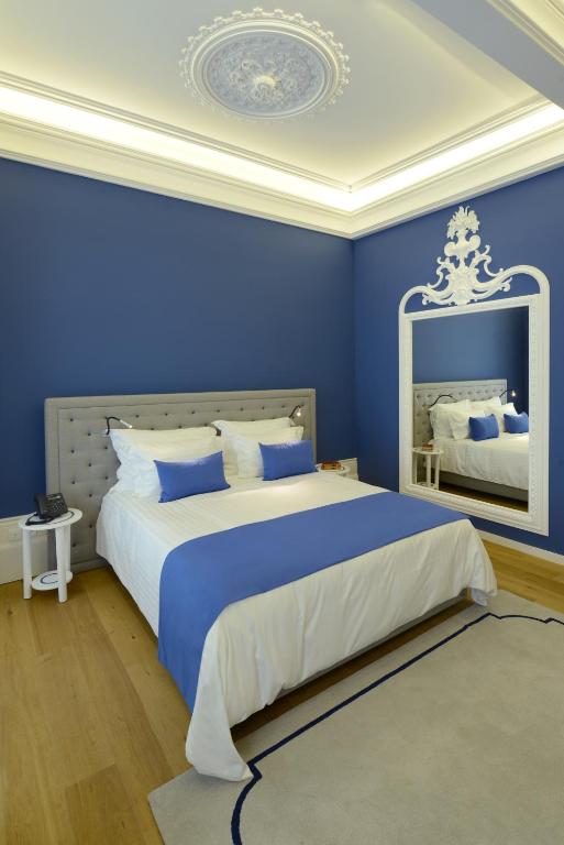 Postel nebo postele na pokoji v ubytování EMAJ Boutique Hotel