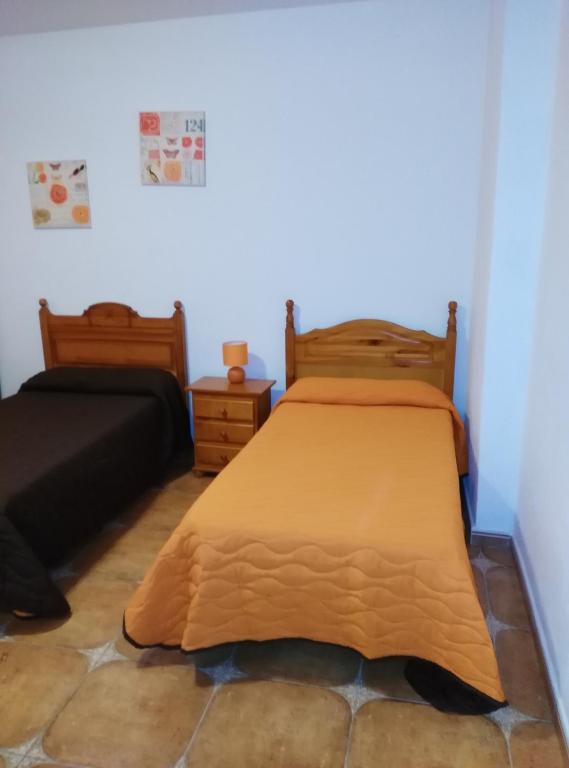 Postel nebo postele na pokoji v ubytování Pensión Amparo Las Hayas